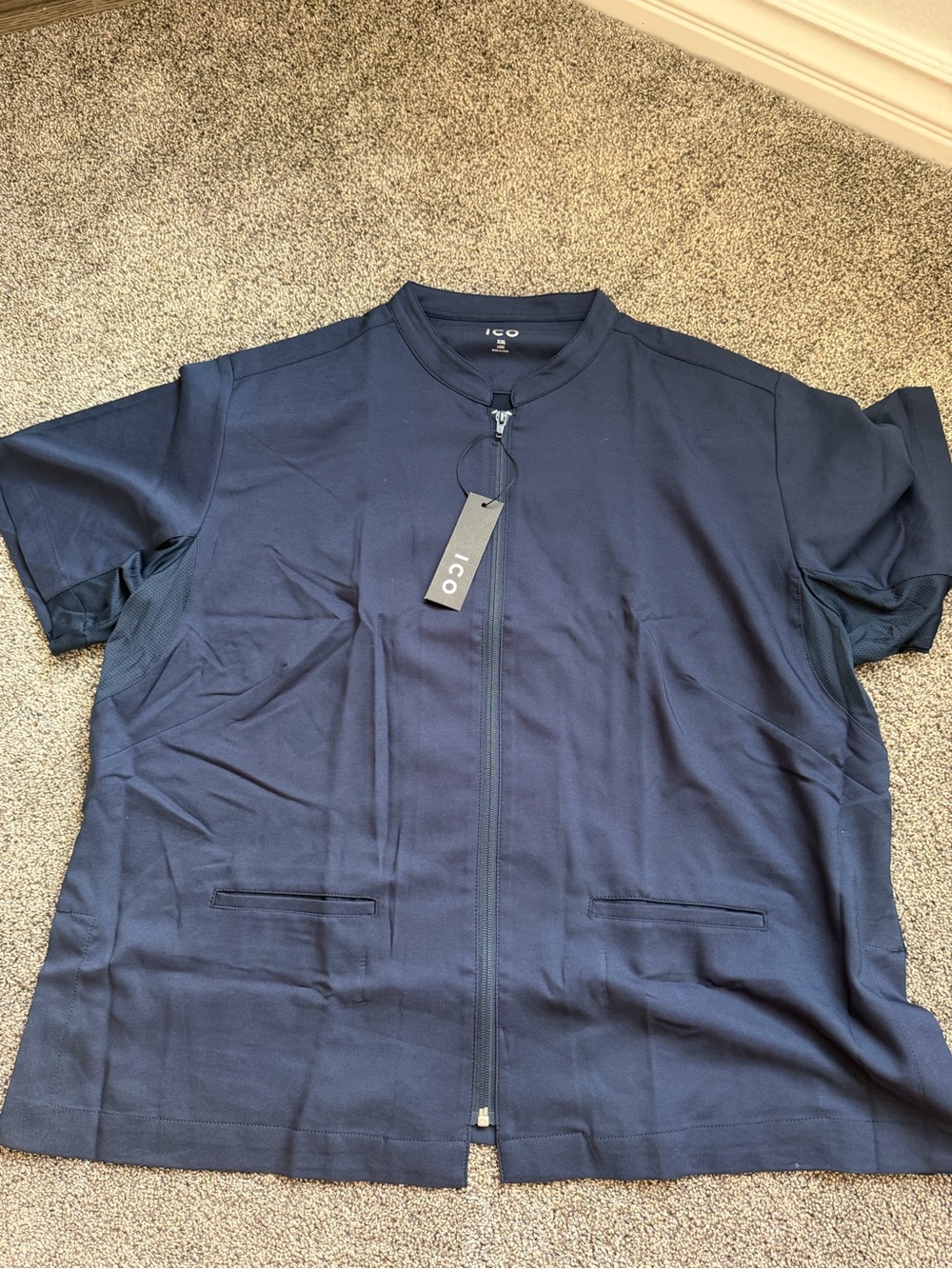 navy blue zip-front scrub top from ICO in size XL